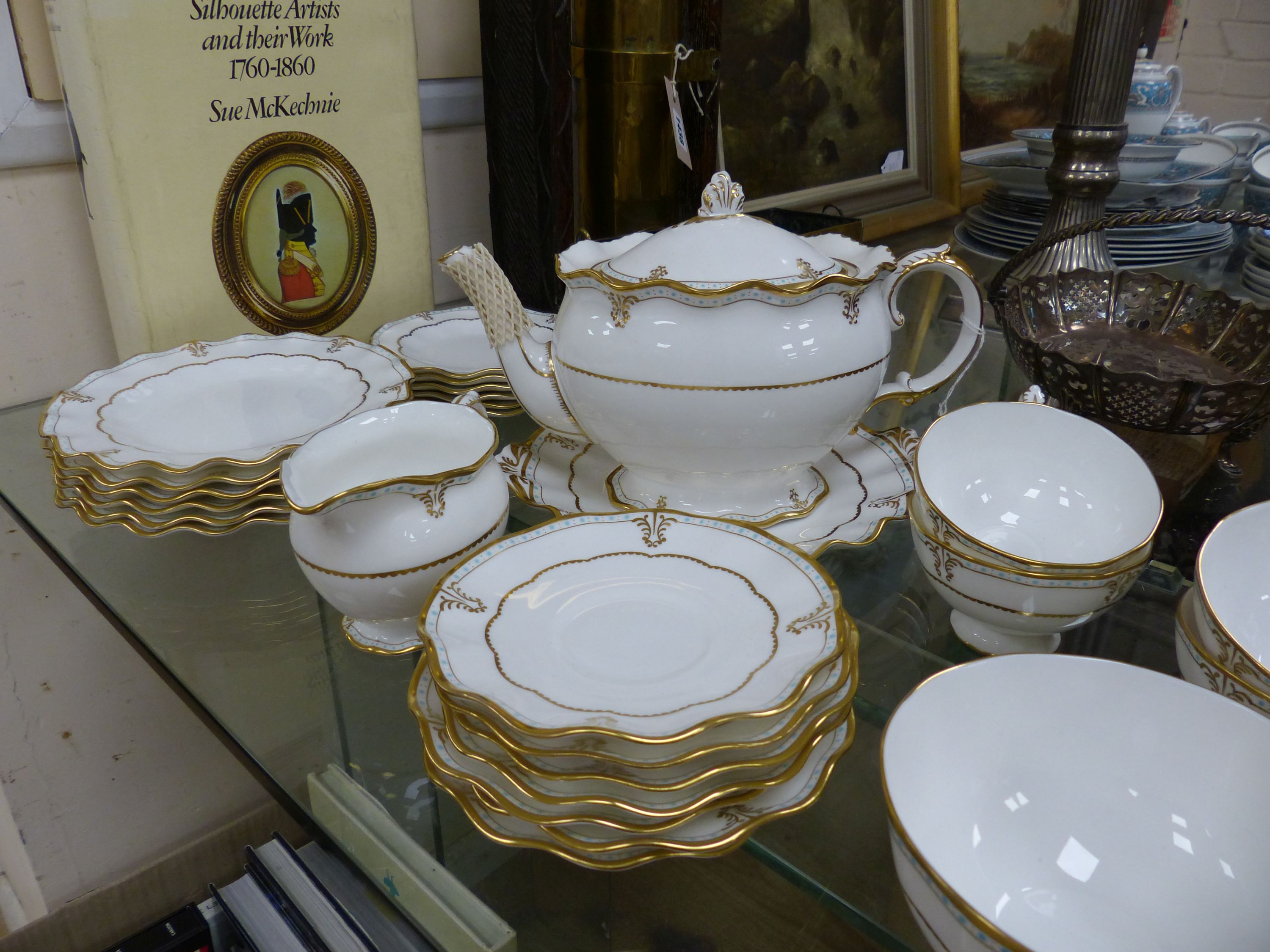 A Royal Crown Derby white bone china tea service with gilt and turquoise decoration, Lombardi pattern